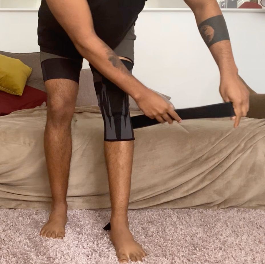 How To Put On The Anaconda Brace? - Step-by-Step Guide 5 grab a strap - Anaconda knee sleeve